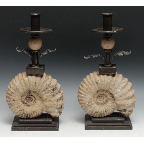 224 - Interior Decoration - a pair of  unusual wrought steel and faux-palaeontological candlesticks, each ... 