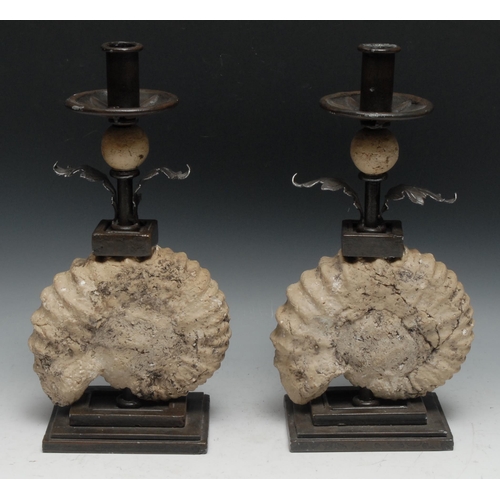 224 - Interior Decoration - a pair of  unusual wrought steel and faux-palaeontological candlesticks, each ... 