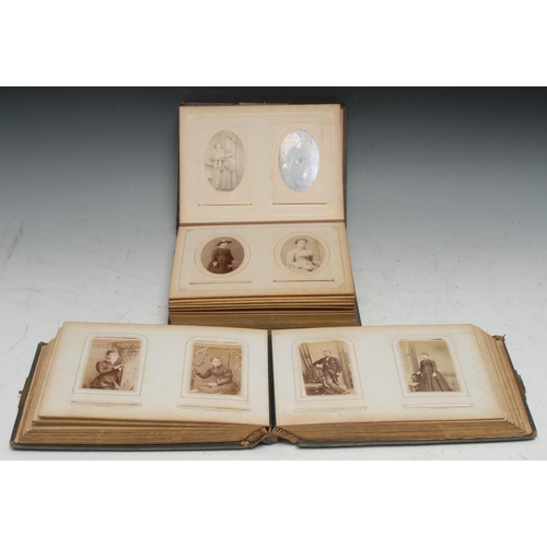 957 - Photography - a 19th century tooled leather carte de visite album, containing various single and gro... 