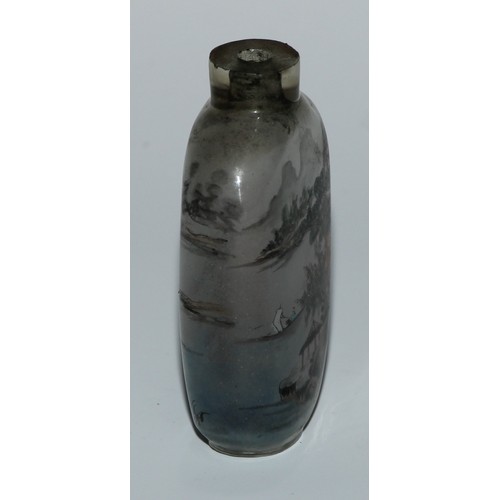 292 - A Chinese inside painted glass snuff bottle, decorated with figures in a monumental landscape, 7cm h... 