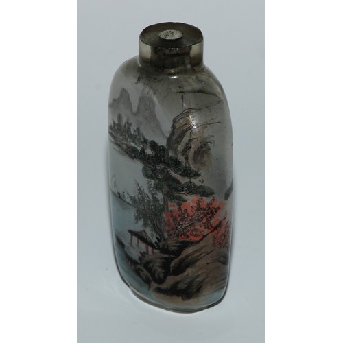 292 - A Chinese inside painted glass snuff bottle, decorated with figures in a monumental landscape, 7cm h... 