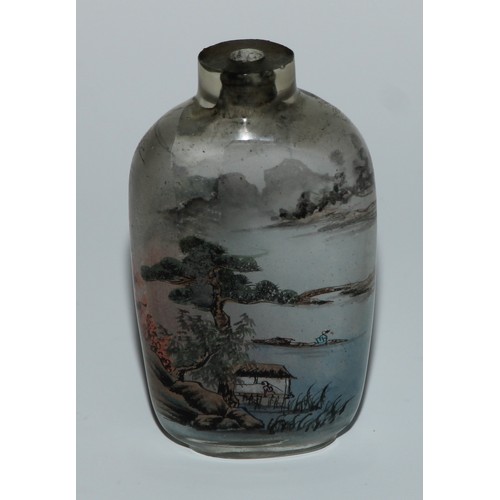 292 - A Chinese inside painted glass snuff bottle, decorated with figures in a monumental landscape, 7cm h... 