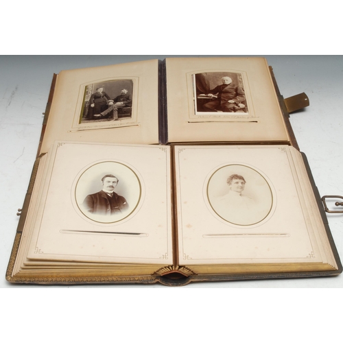 960 - Photography - a late 19th century tooled leather carte de visite album, containing mostly single por... 