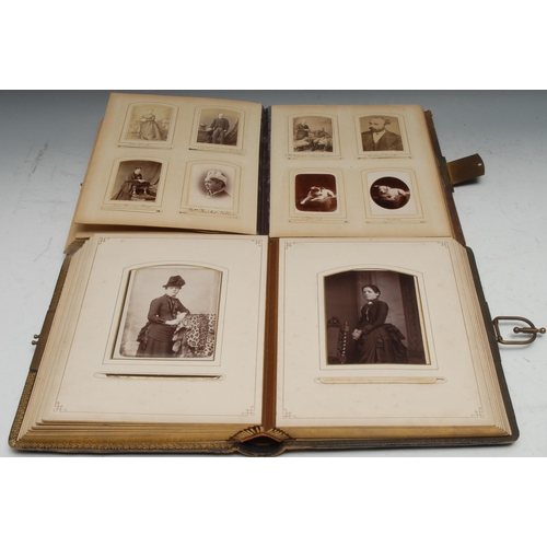 960 - Photography - a late 19th century tooled leather carte de visite album, containing mostly single por... 