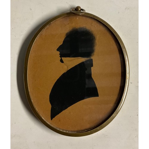 151 - English School (19th century), a silhouette, of a gentleman, with frizzy hair and a stiff collar, bu... 