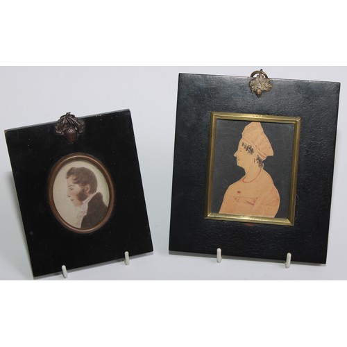 142 - English School (19th century), a cut-paper portrait miniature, of a lady wearing a coral necklace, b... 