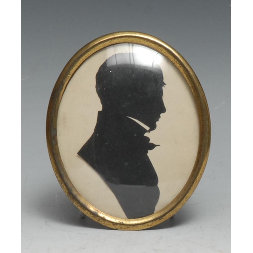 143 - English School (19th century), a cut-paper silhouette, of a young gentleman, bust-length in profile,... 