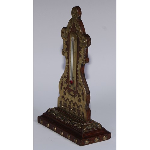 162 - A 19th century oak desk thermometer, applied overall with brass cut-card work, 22.5cm high, c.1870