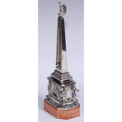 538 - An early 20th century silvered obelisk desk thermometer, eagle finial, the friece with bas relief an... 