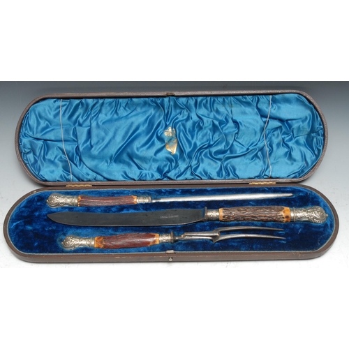 200 - A Victorian three piece carving set, comprising knife, fork and steel, by Henry Clegg & Sons, Sheffi... 