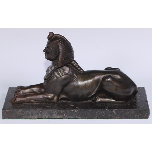 114 - A 19th century library model, cast as a sphinx, rectangular marble base, 28cm long