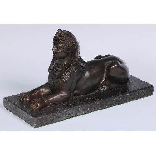 114 - A 19th century library model, cast as a sphinx, rectangular marble base, 28cm long