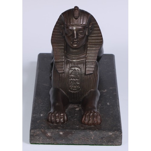 114 - A 19th century library model, cast as a sphinx, rectangular marble base, 28cm long