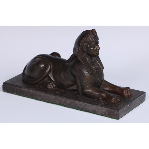 114 - A 19th century library model, cast as a sphinx, rectangular marble base, 28cm long