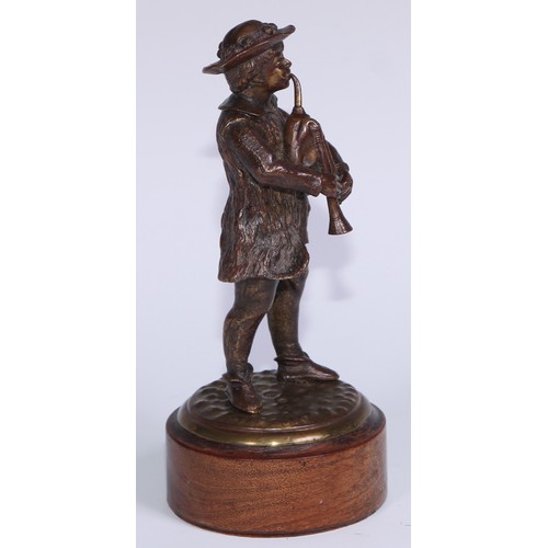 312 - A Continental brown patinated cabinet bronze, of an Alpine bagpiper, 17cm high