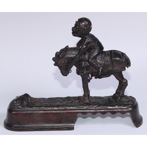 6 - A 19th century American cast iron novelty mechanical bank money box, as a jockey thrown  from his mo... 