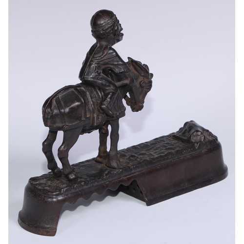 6 - A 19th century American cast iron novelty mechanical bank money box, as a jockey thrown  from his mo... 