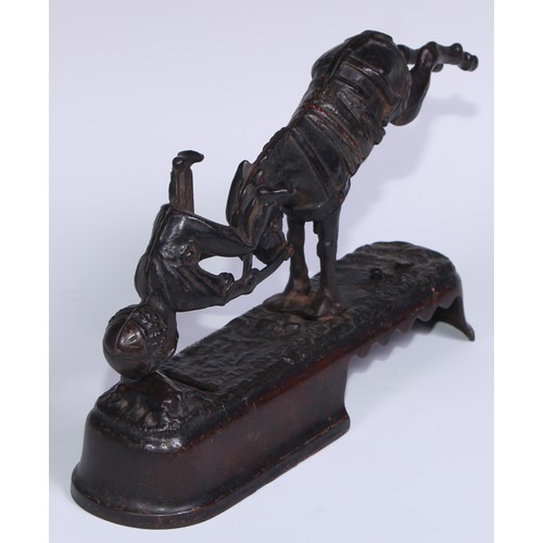 6 - A 19th century American cast iron novelty mechanical bank money box, as a jockey thrown  from his mo... 