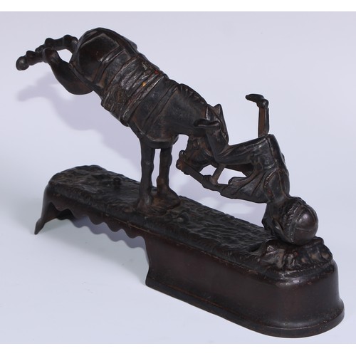 6 - A 19th century American cast iron novelty mechanical bank money box, as a jockey thrown  from his mo... 