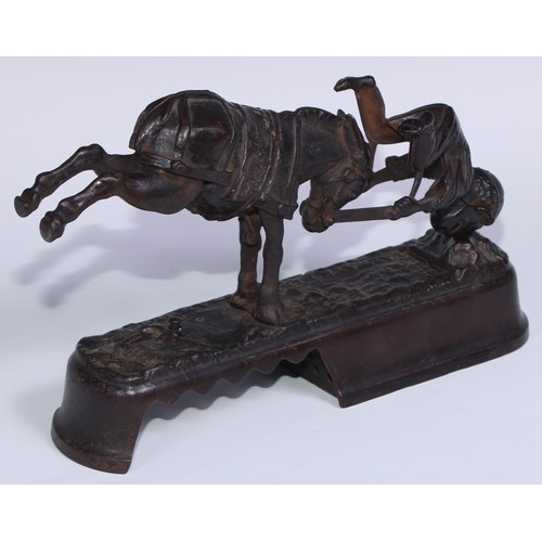 6 - A 19th century American cast iron novelty mechanical bank money box, as a jockey thrown  from his mo... 