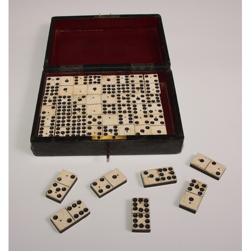 451 - A set of 19th century bone and ebony double nine  dominoes, associated tooled morocco leather box, 2... 