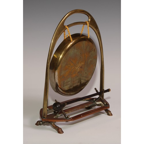 476 - A Victorian brass and copper novelty table top dinner gong, of equestrian interest, as an oversize s... 