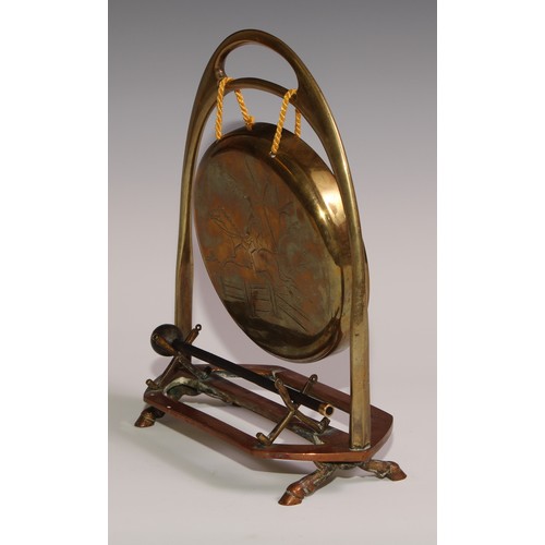 476 - A Victorian brass and copper novelty table top dinner gong, of equestrian interest, as an oversize s... 