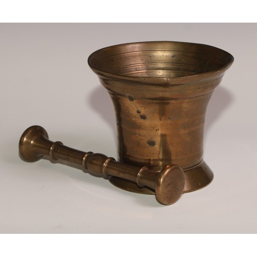 493 - An 18th century bronze bell shaped pestle and mortar, skirted base, 11.5cm high, 13cm diam, c.1760; ... 