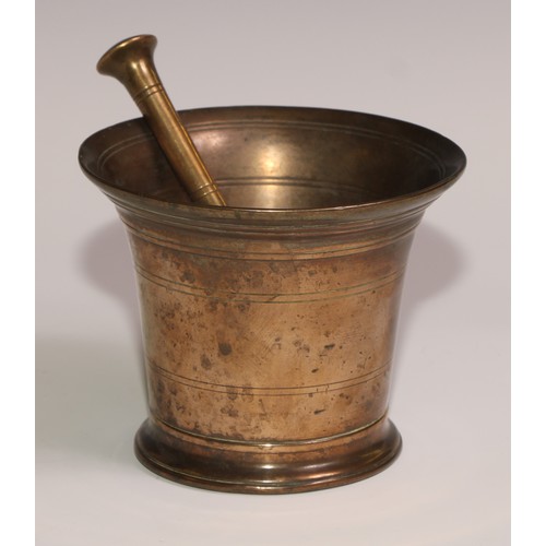 493 - An 18th century bronze bell shaped pestle and mortar, skirted base, 11.5cm high, 13cm diam, c.1760; ... 