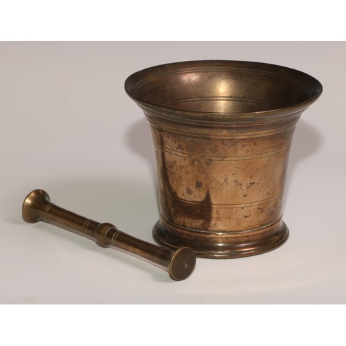 493 - An 18th century bronze bell shaped pestle and mortar, skirted base, 11.5cm high, 13cm diam, c.1760; ... 