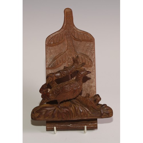 58 - A Black Forest novelty wall hanging letter rack, carved with a game bird, 21.5cm long, c.1900 (re-pu... 