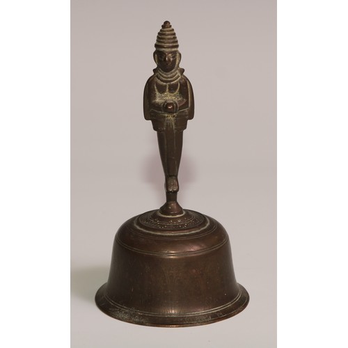 34 - A 19th century cast iron and brass desk or table bell, the base in relief with palmettes and lotus, ... 