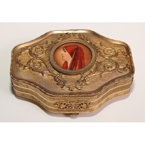 313 - A Continental gilt metal quatrefoil casket, the hinged cover centred by a porcelain plaque, decorate... 