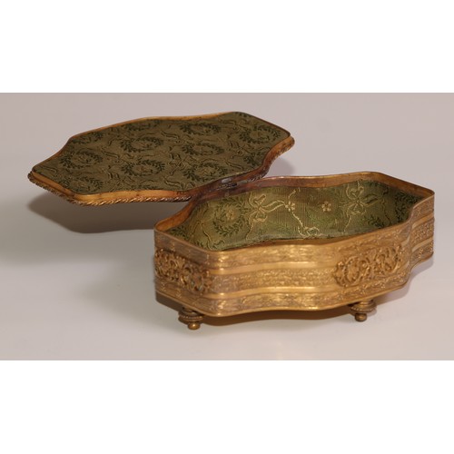 313 - A Continental gilt metal quatrefoil casket, the hinged cover centred by a porcelain plaque, decorate... 