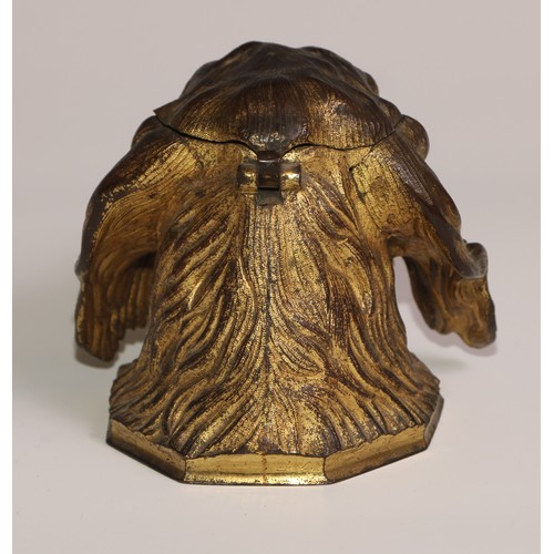 54 - A 19th century gilt metal novelty inkwell, cast as the head of a spaniel dog, hinged cover, the pen ... 