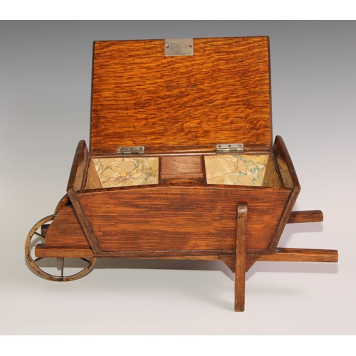 197 - A Victorian oak novelty cigar box, as a wheel barrow, hinged cover enclosing an interior fitted as a... 