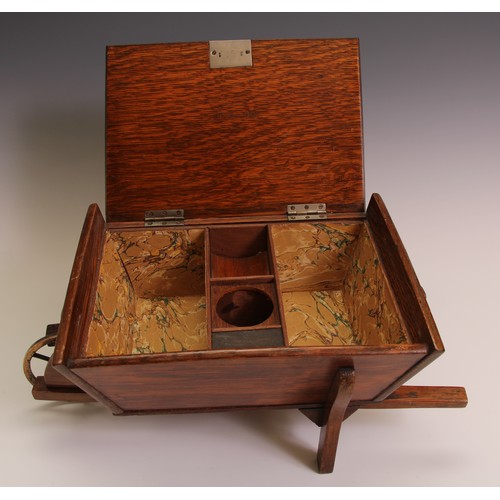 197 - A Victorian oak novelty cigar box, as a wheel barrow, hinged cover enclosing an interior fitted as a... 