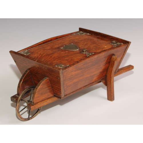 197 - A Victorian oak novelty cigar box, as a wheel barrow, hinged cover enclosing an interior fitted as a... 