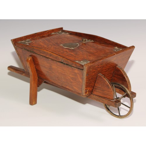 197 - A Victorian oak novelty cigar box, as a wheel barrow, hinged cover enclosing an interior fitted as a... 