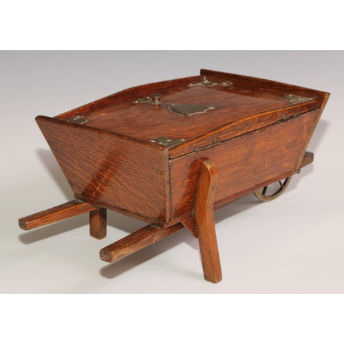 197 - A Victorian oak novelty cigar box, as a wheel barrow, hinged cover enclosing an interior fitted as a... 