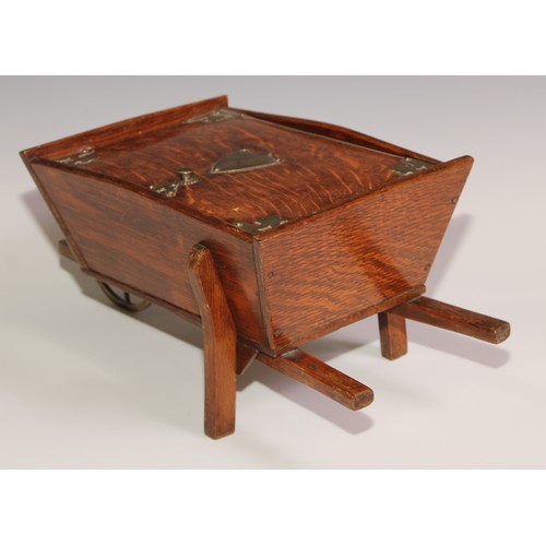 197 - A Victorian oak novelty cigar box, as a wheel barrow, hinged cover enclosing an interior fitted as a... 