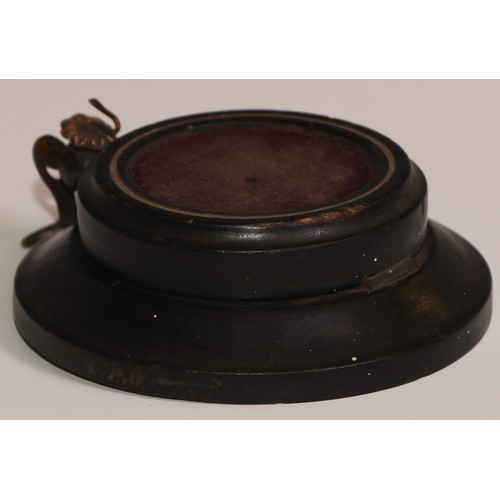 45 - A 19th century French ebonised pocket watch stand, hinged upon a dished base, 10cm diam, c.1870