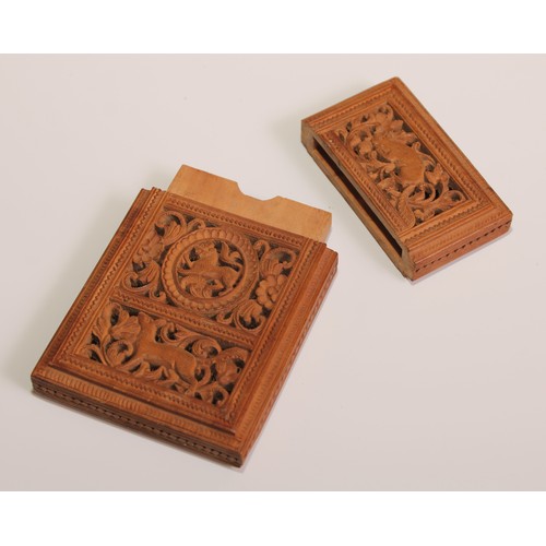 108 - A 19th century Indian sandalwood rectangular visiting card case, pierced and carved with a bird and ... 