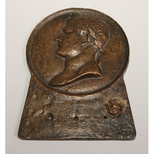 284 - A bronze plaque, cast in relief with a profile portrait of Caesar, 17cm long; a bronze horn or vesse... 