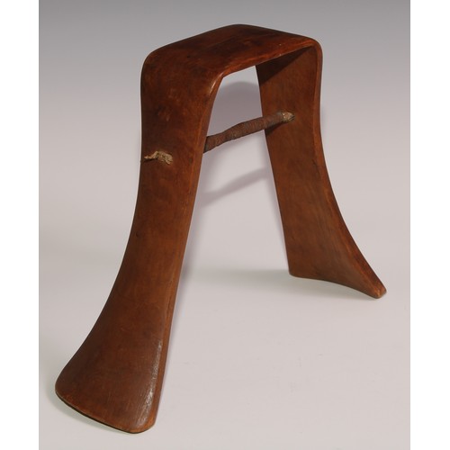 721 - Tribal Art - a Karamojong headrest, of typical inverted-U form, 23cm high, Uganda/Ethiopia; another,... 