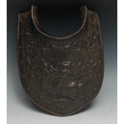 443 - A Renaissance Revival cast iron breast plate, in relief with a battle scene after the Antique, 30cm ... 