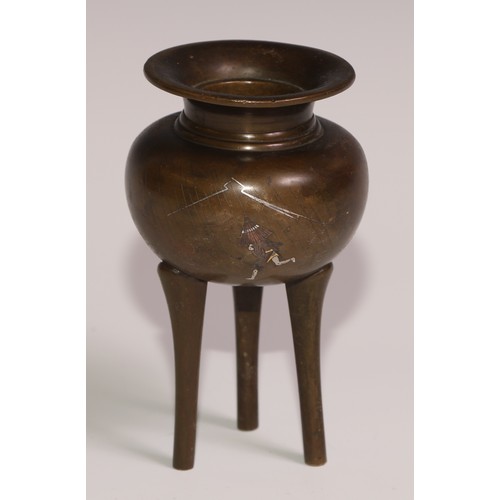 130 - A Japanese brown patinated bronze tripod koro, inlaid in silver and mixed metals with a cockerel and... 