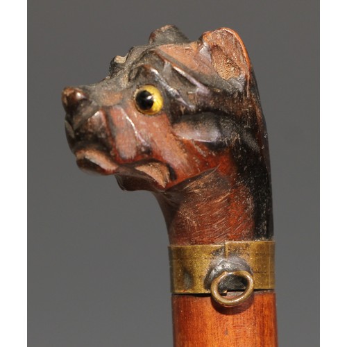 534 - An early 20th century novelty letter knife or page turner, the handle carved as the head of a pug do... 