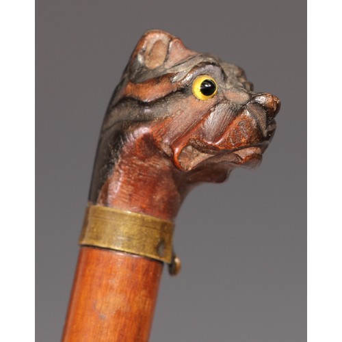 534 - An early 20th century novelty letter knife or page turner, the handle carved as the head of a pug do... 