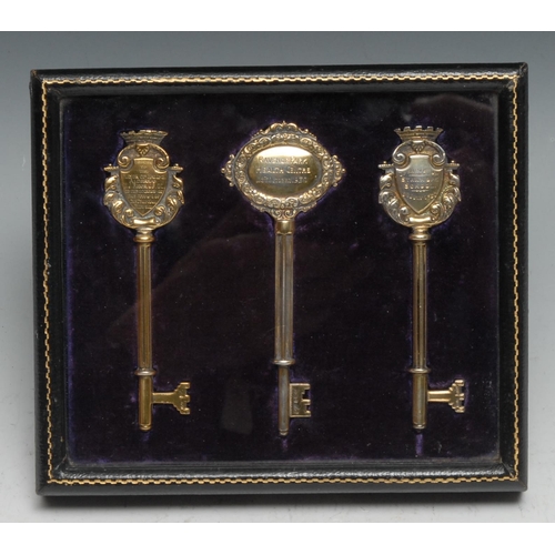 85 - Copoclephily - a suite of three George V silver-gilt presentation keys, presented to Mayor of Ealing... 